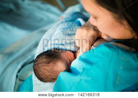 Mothers Breastfeed While Dating A Beautiful Golden Sunset.