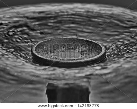 Flat jet of water out of a waterspout fountain