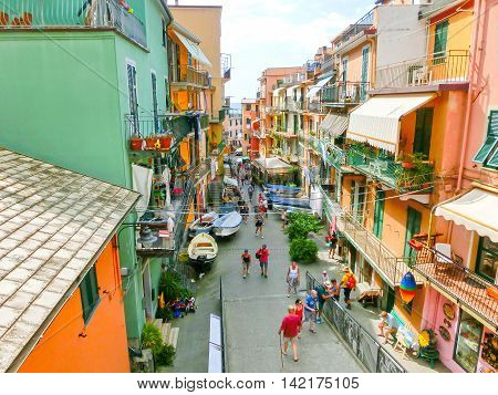 Riomaggiore Italy - September 09 2015: Central street of Riomaggiore a village in province of La Spezia Liguria Italy. Cinque Terre UNESCO World Heritage Site