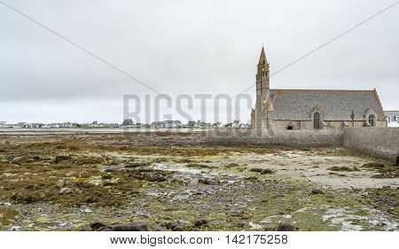 coastal scenery including a church around Penmarch in the Finistere department of Brittany in France