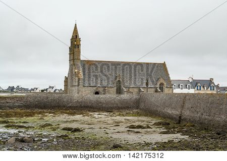 coastal scenery including a church around Penmarch in the Finistere department of Brittany in France