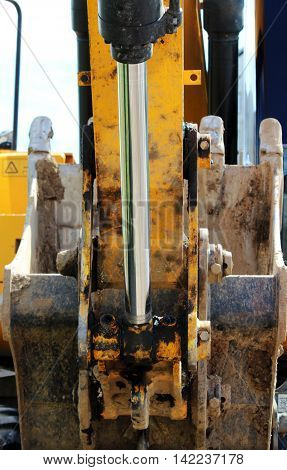isolated steel hydraulic piston to crane, which lifts and lowers the concrete slab during repair work