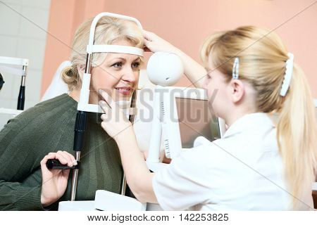 Female ophthalmologist or optometrist at work