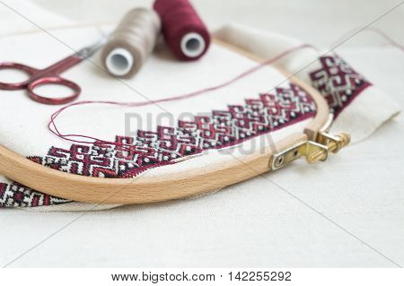 Fragment of embroidery on linen and accessories
