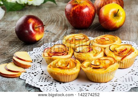 Apple rose shaped pie. Homemade apple dessert pie. Sweet apple rose pastry.