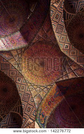 SHIRAZ IRAN - 3 MAY 2016: Detail of the ceiling tilework decoration in the Nasir al Molk or Pink Mosque in Shiraz Iran.