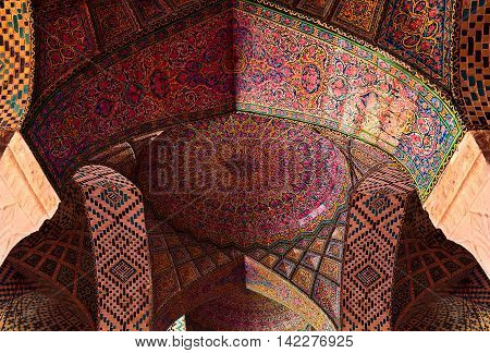 SHIRAZ IRAN - 3 MAY 2016: Detail of the ceiling tilework decoration in the Nasir al Molk or Pink Mosque in Shiraz Iran.