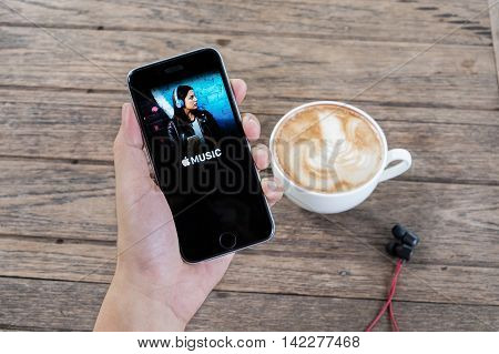 CHIANG MAI THAILAND - JULY 26 2016: A man hand holding screen shot of Apple music app showing on iPhone 6s. Apple Music is the new iTunes-based music streaming service that arrived on iPhone.