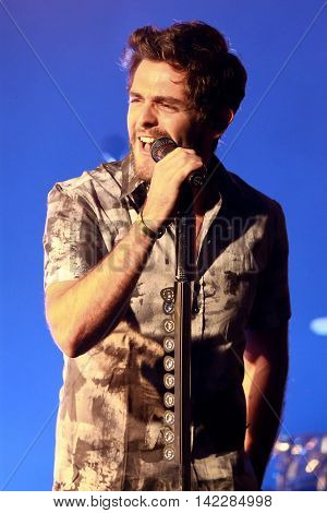 NEW YORK-SEPT 28: Country music artist Thomas Rhett performs at the iHeartRadio Album Release Party with Thomas Rhett on September 28, 2015 at the iHeartRadio Theater in New York City.