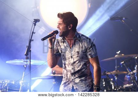 NEW YORK-SEPT 28: Country music artist Thomas Rhett performs at the iHeartRadio Album Release Party with Thomas Rhett on September 28, 2015 at the iHeartRadio Theater in New York City.