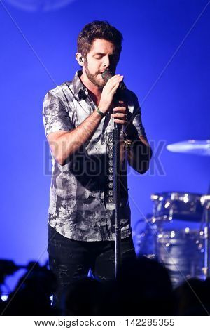 NEW YORK-SEPT 28: Country music artist Thomas Rhett performs at the iHeartRadio Album Release Party with Thomas Rhett on September 28, 2015 at the iHeartRadio Theater in New York City.