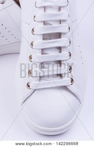 Women's leather sport shoes on white background