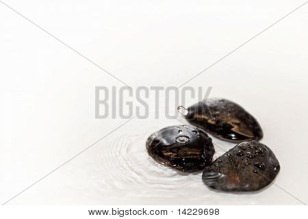 3 stones on shallow water