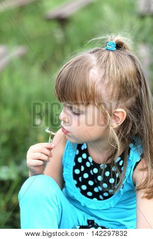 Little Girl With Long Hair Playing On Grass In Summer