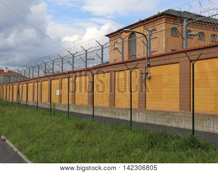 High security wall the city jail with barbed wire