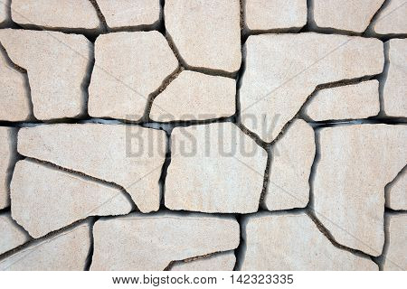 Bright sandstone tile wall texture and background