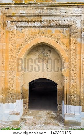 The stone gate of Agzikarahan Caravan Saray decorated with carved islamic patterns Agzikarahan Cappadocia Turkey.