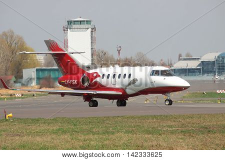 Kiev Ukraine - April 14 2012: Hawker 900XP Business Jet is taxiing to the runway for takeoff