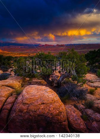 Arches National Park In Utah Comes Alive During Summer As A Thunderstorm At Sunset Creates A Stunnin
