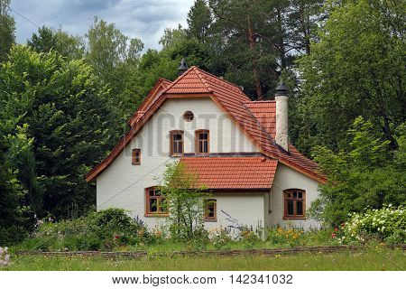White vintage house in the forest photo