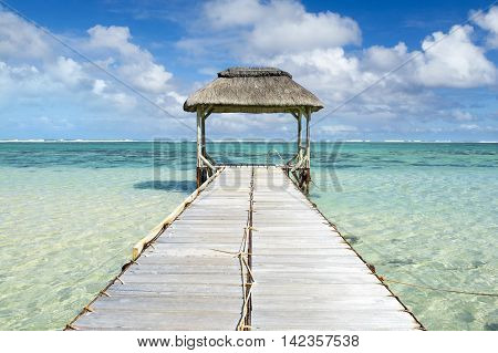 Landscape witn wooden pier in Bel Ombre beach, Mauritius island