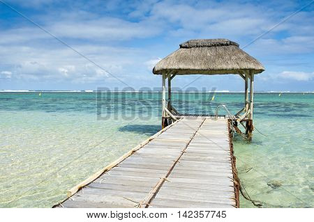 Wooden pier in Bel Ombre beach, Mauritius island