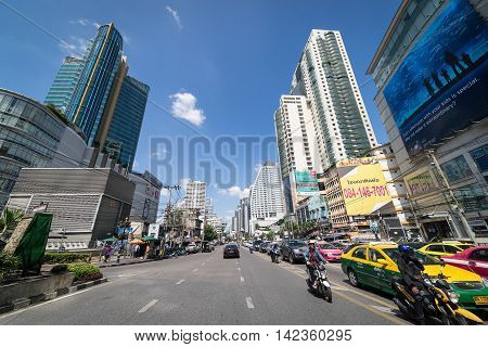 Bangkok, Thailand - October 31, 2015: Asoke on October 31, 2015. Cars and Motorcycle are waiting for the green light on Asoke Junction.