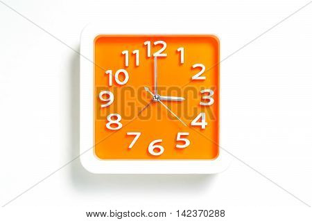 Orange Plastic Clock counting 3:00 o clock