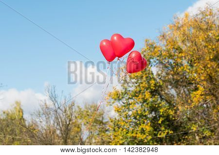 Valentine heart balloon against blue sky background