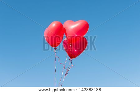 Valentine heart balloon against blue sky background