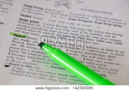 The word learn is highlighted and defined in a dictionary.