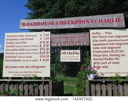 Roadhouse restaurant menu sign on dam across the zuidersee
