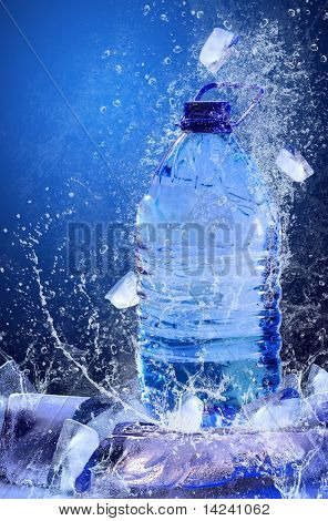 Buttle of water on the ice. Splash of water