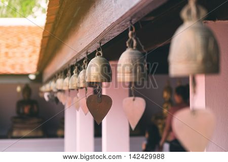 Tradition asian bells hanging in the temple. Filterd color.