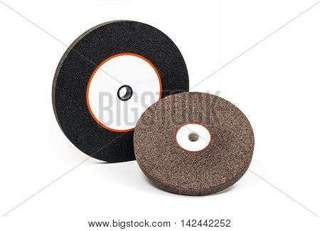 Industrial grinding and polishing wheels on white background