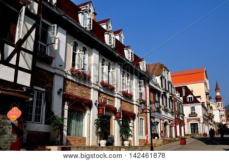 Bai Lu China - November 17 2013: View looking north on the principal street of the Sino-French village with its handsome French Alsatian style buildings