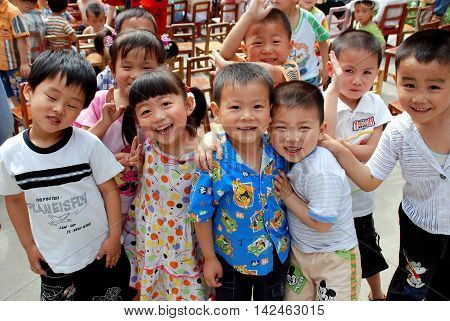 Pengzhou China - May 24 2007: Smiling children at the Miao-Miao school on National Children's Day
