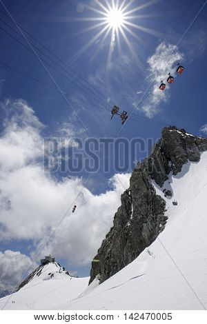 Punta Helbronner (Pointe Hellbronner) Station - 3462 m and Cable Cars against a Blue Sunny Sky. Aosta Valley Italy