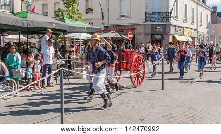 Antique Firefighters To Intervene With A Water Pump