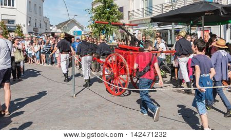 Antique Firefighters To Intervene With A Water Pump