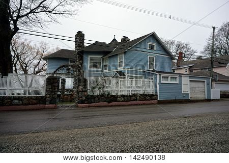 WEQUETONSING, MICHIGAN / UNITED STATES - DECEMBER 22, 2015: A large blue mansion on Beach Drive in Wequetonsing.