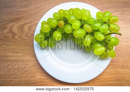 bunch green grapes on wooden background food closeup