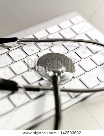 Selective focus of a computer keyboard and medical stethoscpoe. It-support.