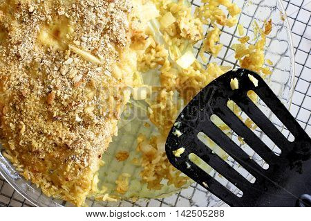 Salmon and whitebait quiche on a glass plate.
