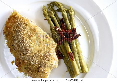 Salmon and whitebait quiche with asparagus and dried tomato.