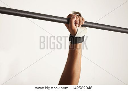 Hand Of A Dark-skinned Athlete Grabbing Pullup Bar