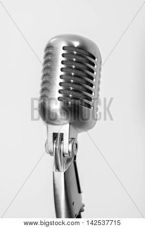 Classic Vintage microphone on black white ground