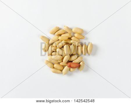Heap of unsalted shelled peanuts