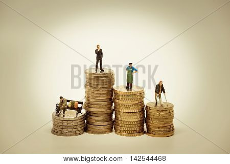 People of various social groups on pile of coins. Financial concept.