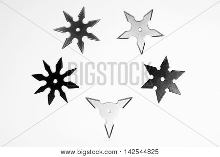 Five different shurikens are on white background.